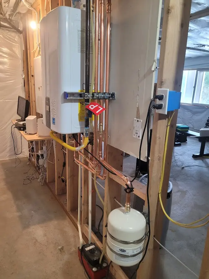 Licensed plumber repairing a kitchen sink in Woodbridge