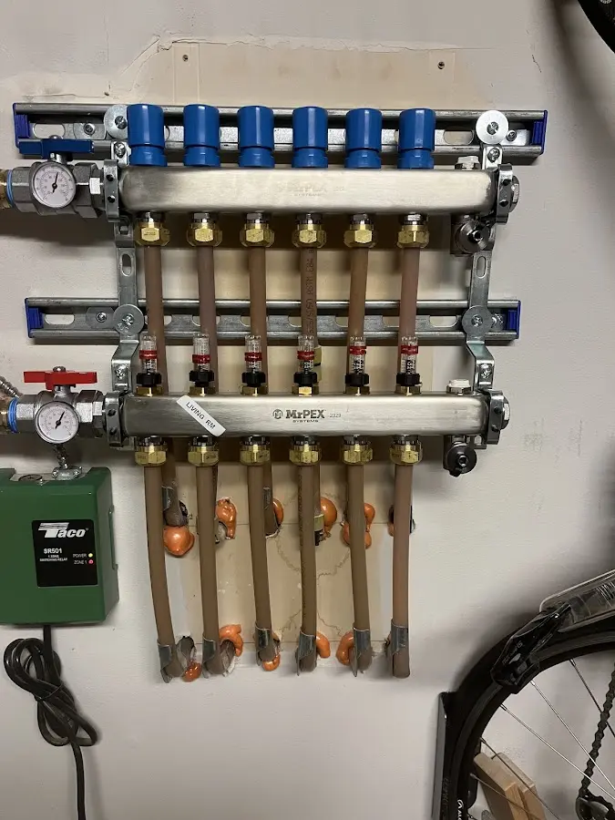 Plumber performing Water Heater Repair at a residential property in Woodbridge